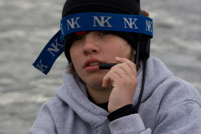 Men's Novice 8: Jon wears coxbox