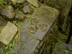 someone left a trefoil design in small rocks by the well