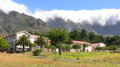 High School in District 6 with cloud-covered Table Mountain in background 