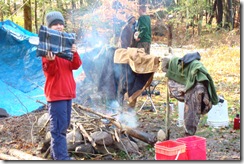 drying clothing over a fire