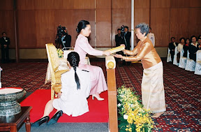 HRH presenting Tipitaka volume to Patrons of Dhamma Society to be handed over in India, Japan and Sweden, 2007 