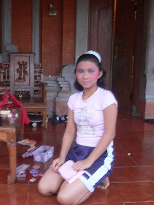 His daughter, a Legong dancer, preparing for a performance
