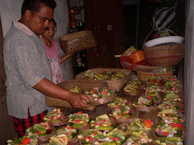 Losmen family preparing offerings for the next day