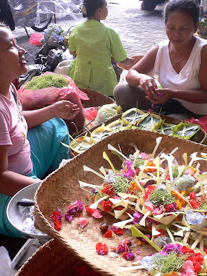 Canang sellers, offerings in tiny woven coconut leaf baskets