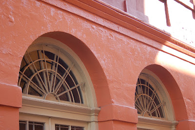 Colorful coral paint on building in New Orleans, French Quarter. 