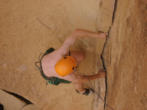 Tommy practicing his crack climbing skills