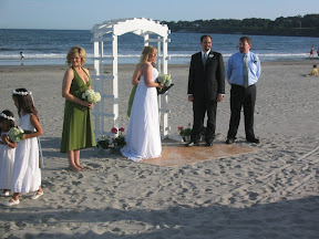 Lew and Cheryl, getting married on a piece of plywood in the sand