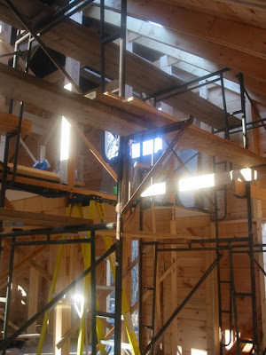 Looking toward the back kitchen door, with scaffold in sunlight, and the natural skylight.