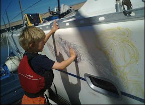 Rowan's fingerpaint artwork on side of s/v Excellent Adventure