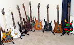 My Ibanez collection as of Sept 2000... L to R: RG-ART J-Custom, Jem7-VWH, UV777-BK Universe, USRG30-TP USA Custom, Jem7-BSB, RG7CT-VV Prestige, RG3120-TW Prestige, RG6-CST J-Custom, JPM100-P1