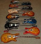 My PRS collection as of Dec 2005... F to B: Custom 24, Custom 24, McCarty Soapbar, Custom 24, Singlecut, Hollowbody II, McCarty Rosewood, Custom 24, Custom 22 semi-hollow, Standard 24, EG-1