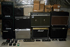 The “Tower of Tone” -- My former amplifier collection... L to R: Carvin AG100D w/ 112AG extension cab, Mesa/Boogie Thiele cab, Crate VC508, Mesa/Boogie Mark IV widebody, Fender Deluxe Reverb, Roland JC120 Jazz Chorus, Marshall JCM2000 TSL122, Egnater/Rocktron TOL100, Mesa/Boogie Rect-o-verb