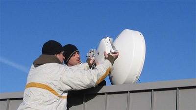 New Bridgewave radio with 2' antenna being installed