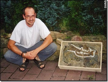 Markus Poschmann with the giant sea scorpion fossil