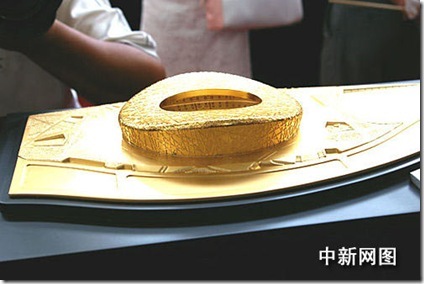 gold plated model of major 2008 Olympic stadium Bird's Nest